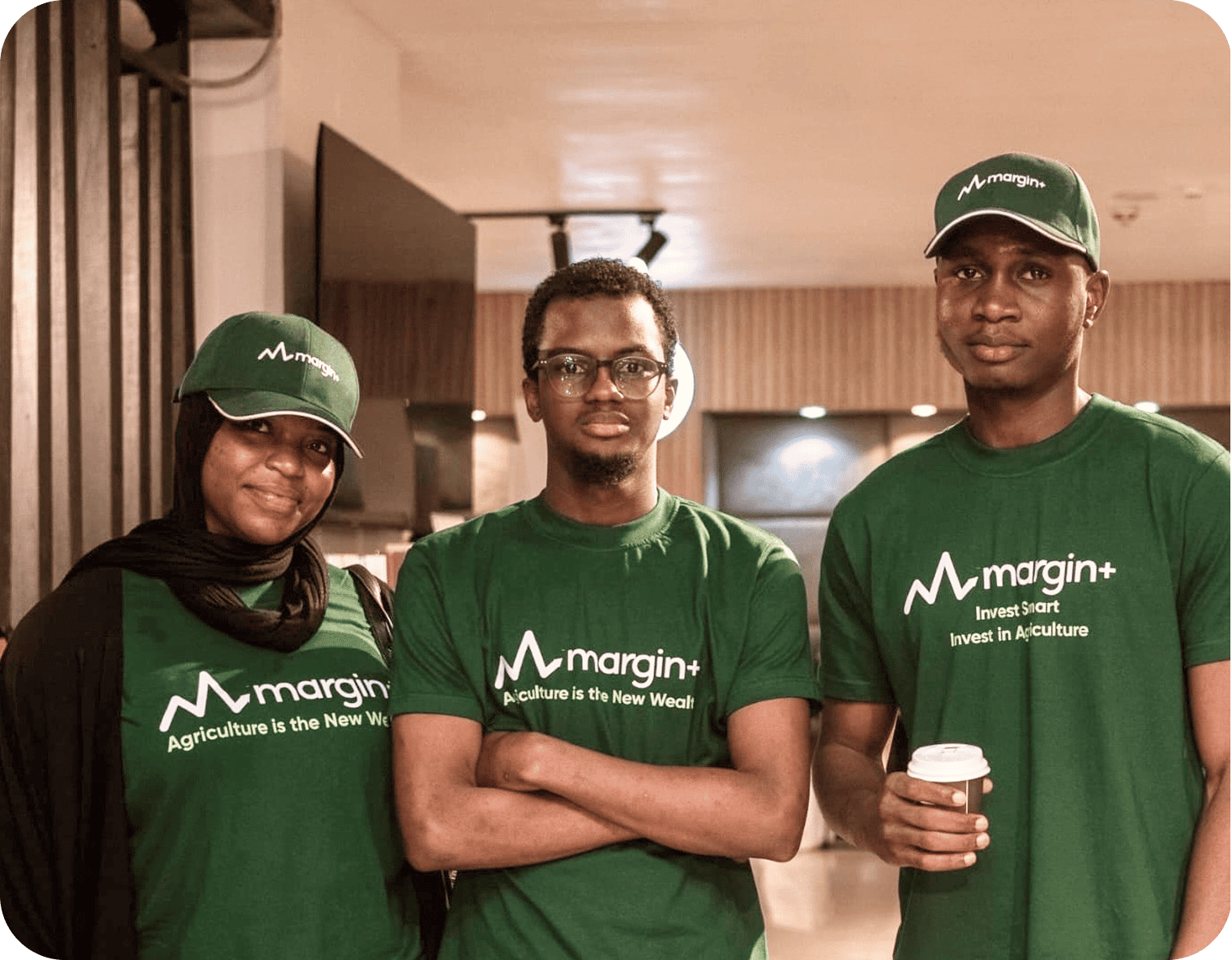 Team members in green shirts